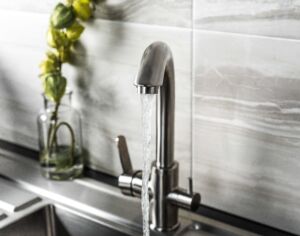 new and modern steel faucet in the kitchen